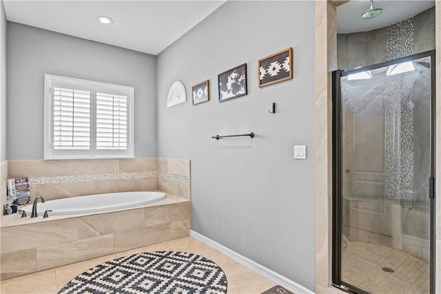 221 Deer Meadows Dr, Alice, TX 78332 - full bath featuring a garden tub, a stall shower, tile patterned flooring, and baseboards