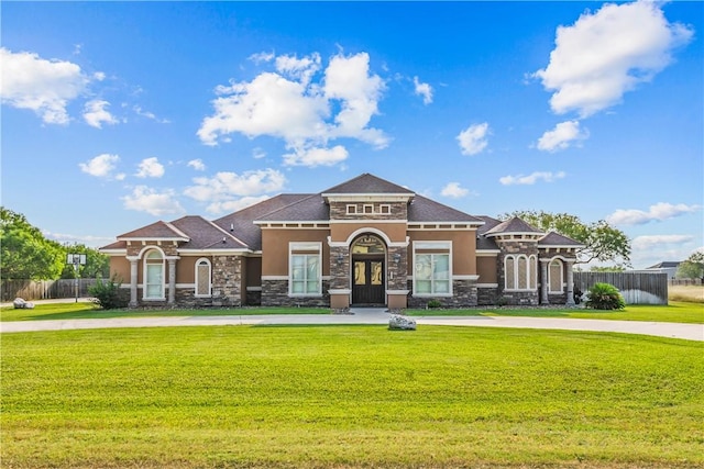 221 Deer Meadows Dr, Alice, TX 78332 - view of front of home with stone siding, stucco siding, and curved driveway