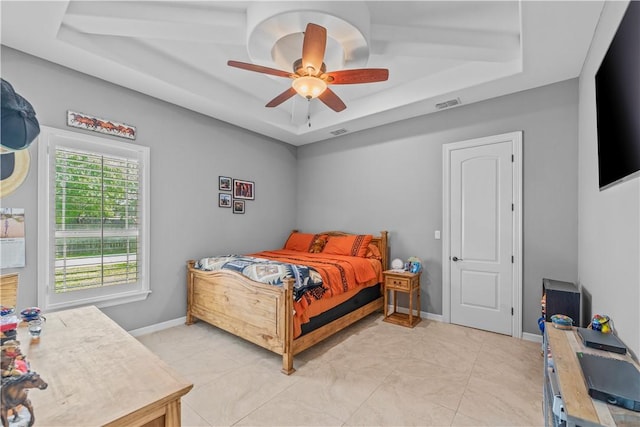 221 Deer Meadows Dr, Alice, TX 78332 - bedroom featuring a tray ceiling, ceiling fan, and baseboards
