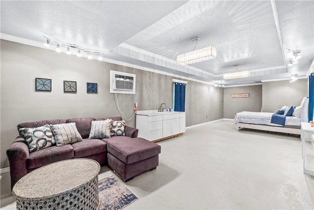 221 Deer Meadows Dr, Alice, TX 78332 - bedroom featuring a wall mounted air conditioner, a tray ceiling, crown molding, concrete floors, and baseboards