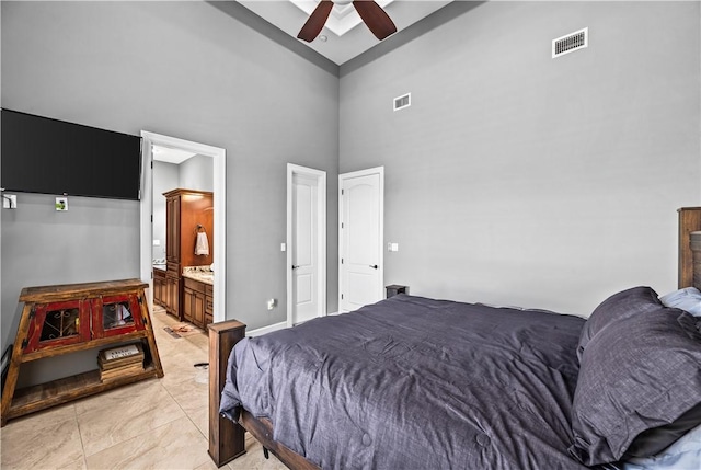 221 Deer Meadows Dr, Alice, TX 78332 - bedroom with high vaulted ceiling, ceiling fan, light tile patterned flooring, and ensuite bath