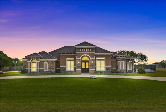 221 Deer Meadows Dr, Alice, TX 78332 - view of front facade featuring stone siding and curved driveway