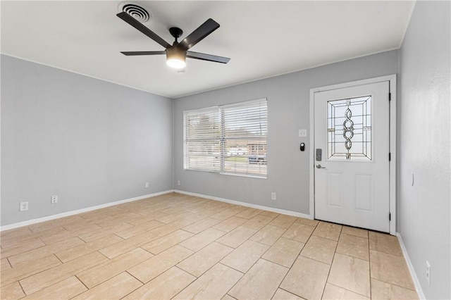 entrance foyer with ceiling fan