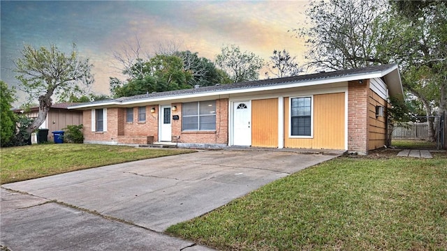 ranch-style house with a yard