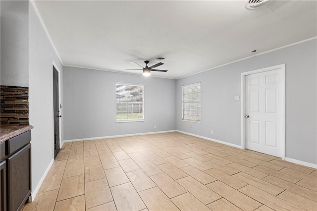 interior space featuring crown molding, ceiling fan, and light wood-type flooring