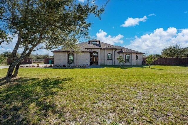 view of front of home with a front lawn