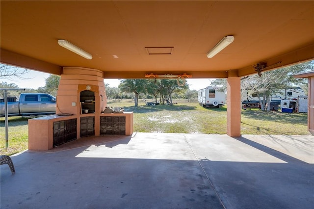 view of patio featuring a fireplace