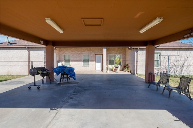 view of patio featuring a grill