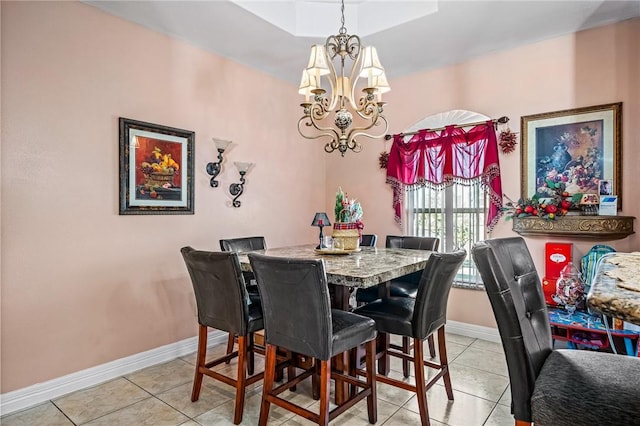 dining room with an inviting chandelier and light tile patterned floors