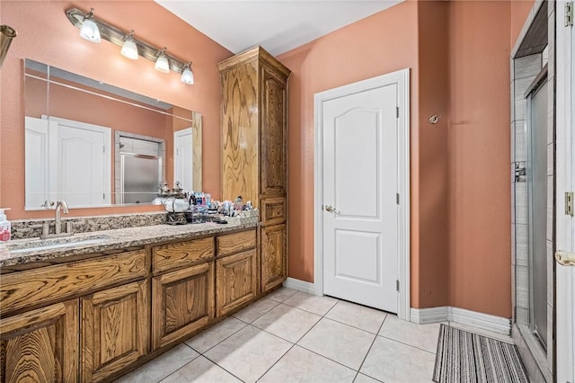 bathroom featuring tile patterned flooring and vanity