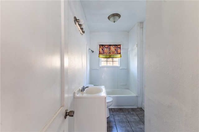 full bathroom with tile patterned flooring, vanity, bathing tub / shower combination, and toilet