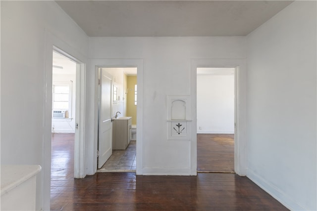 unfurnished room with dark wood-type flooring and sink