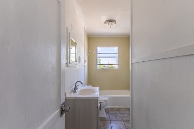 bathroom with vanity, tile patterned floors, and toilet