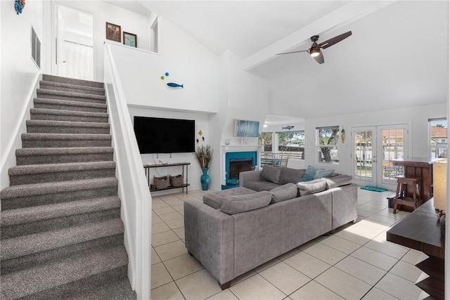 living room with high vaulted ceiling, french doors, ceiling fan, and light tile patterned flooring