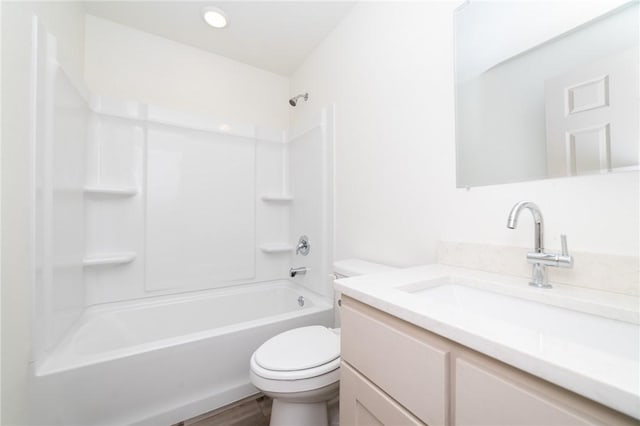 full bathroom featuring vanity, toilet, tub / shower combination, and hardwood / wood-style floors