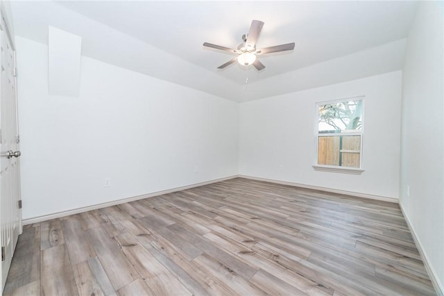 unfurnished room with ceiling fan and light hardwood / wood-style flooring