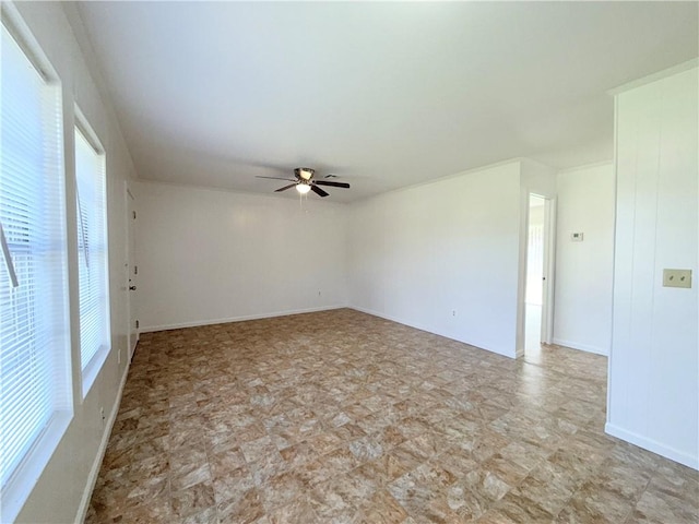 unfurnished room featuring a ceiling fan