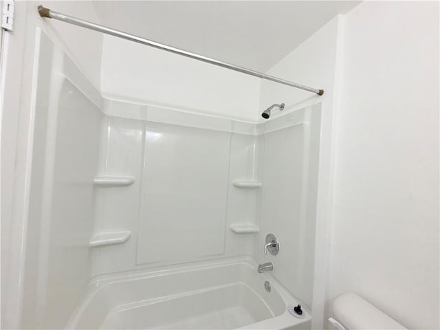 full bath featuring toilet and a shower