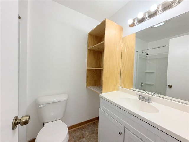 full bath featuring toilet, baseboards, a shower, and vanity