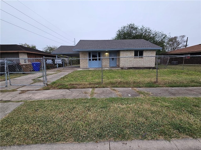 view of front of property with a front lawn and a carport