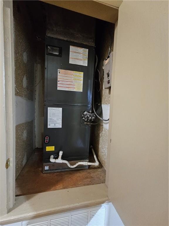 utility room with heating unit