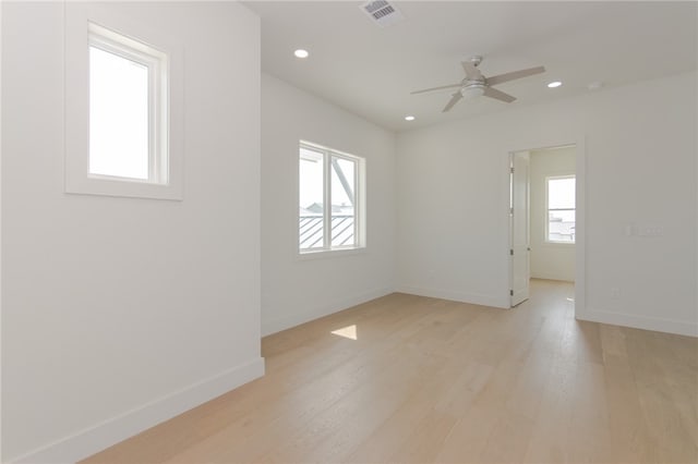 spare room with light hardwood / wood-style floors and ceiling fan