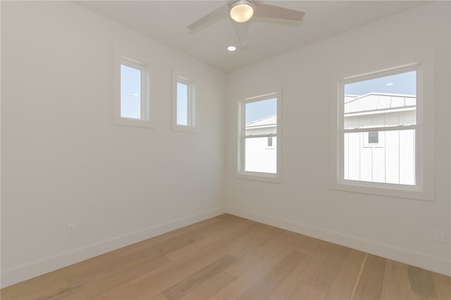 spare room featuring ceiling fan and light hardwood / wood-style floors