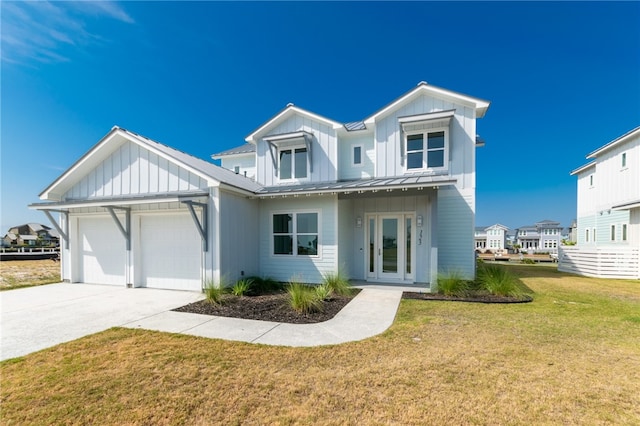 view of front of property with a front lawn and a garage