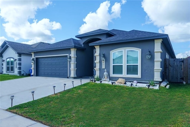 view of front of home with a garage and a front yard