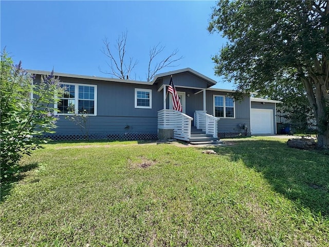 4345 Walton Pl, Corpus Christi, TX 78412 - view of front of property featuring a garage and a front yard