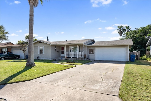 ranch-style home with a front lawn, a garage, and covered porch