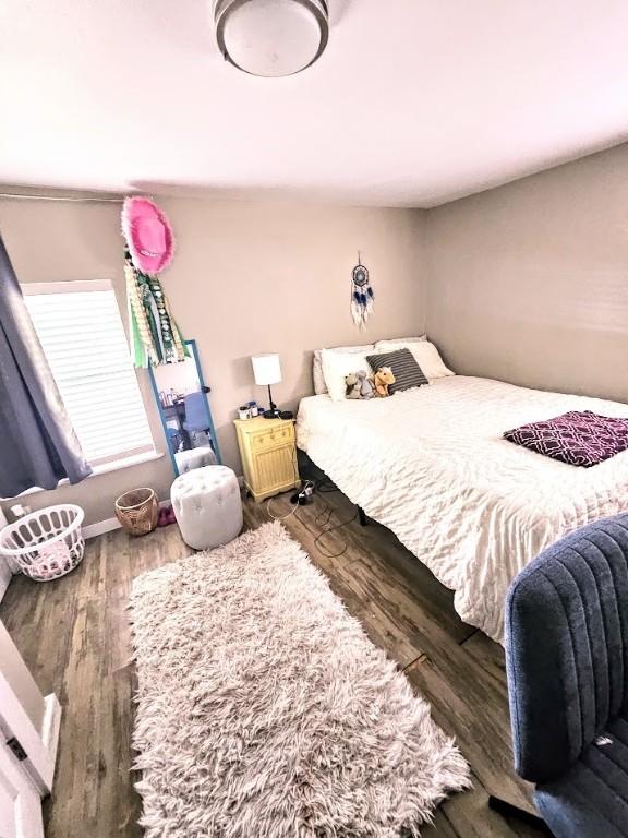 402 E Nopal St, Rockport, TX 78382 - bedroom with wood finished floors