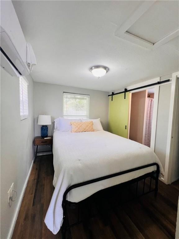 402 E Nopal St, Rockport, TX 78382 - bedroom featuring baseboards, multiple windows, and wood finished floors