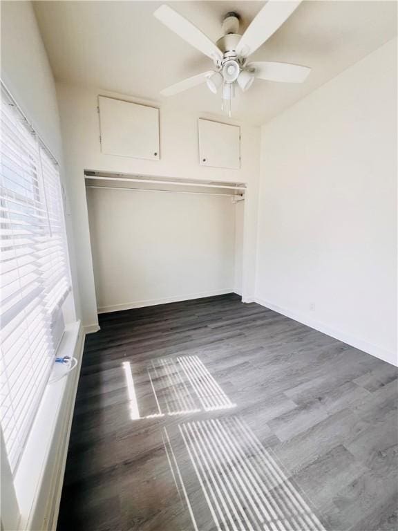402 E Nopal St, Rockport, TX 78382 - unfurnished bedroom featuring baseboards, a ceiling fan, and wood finished floors