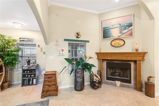 13706 Sea Horse Ave, Corpus Christi, TX 78418 - foyer entrance with a fireplace, crown molding, tile patterned floors, and arched walkways