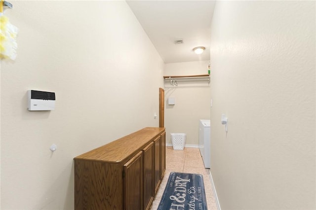 13706 Sea Horse Ave, Corpus Christi, TX 78418 - washroom featuring washer and clothes dryer and light tile patterned floors