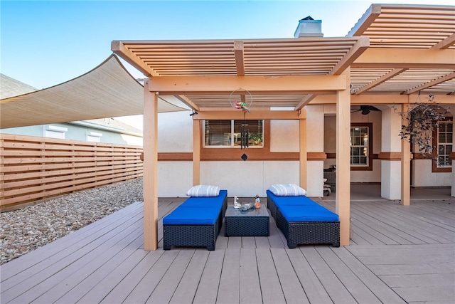 wooden deck with a pergola, ceiling fan, and an outdoor hangout area