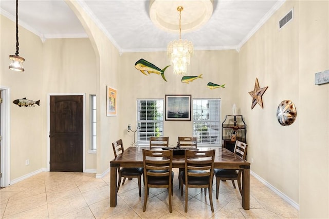 13706 Sea Horse Ave, Corpus Christi, TX 78418 - dining area featuring arched walkways, tile patterned floors, ornamental molding, a high ceiling, and a chandelier