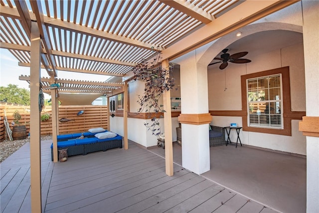 wooden deck featuring a pergola and ceiling fan