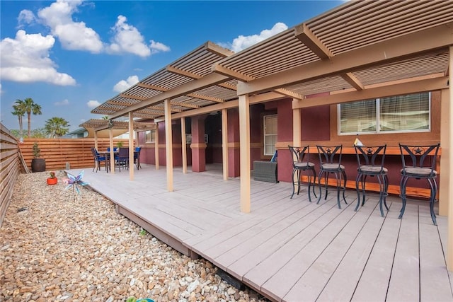 13706 Sea Horse Ave, Corpus Christi, TX 78418 - wooden deck with a fenced backyard, outdoor dining space, and a pergola