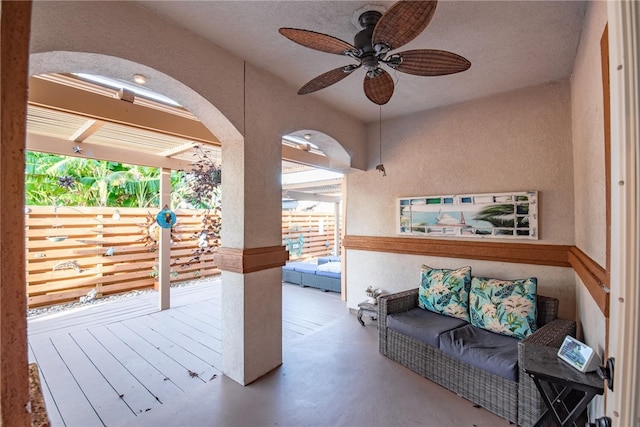 exterior space with a textured ceiling and ceiling fan