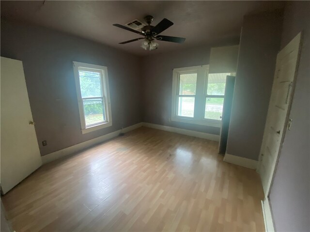 unfurnished bedroom featuring light wood-type flooring and ceiling fan