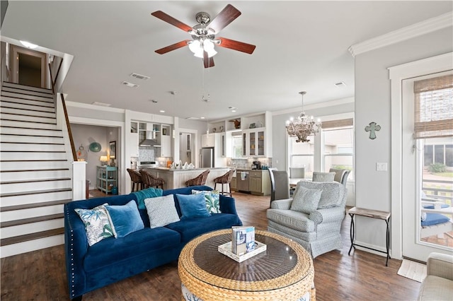 502 Sailhouse Way, Rockport, TX 78382 - living room featuring ceiling fan with notable chandelier, visible vents, stairway, and dark wood finished floors