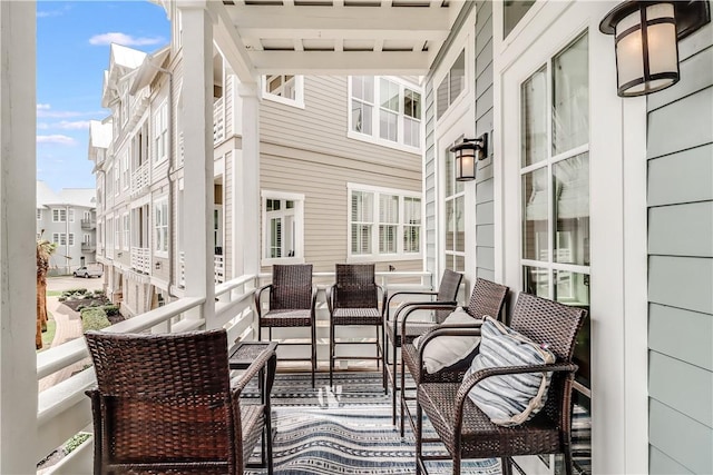 balcony featuring a sunroom