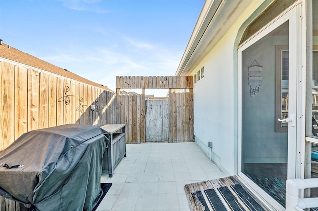 view of patio / terrace with fence and area for grilling