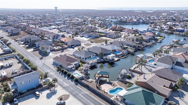 bird's eye view with a water view and a residential view