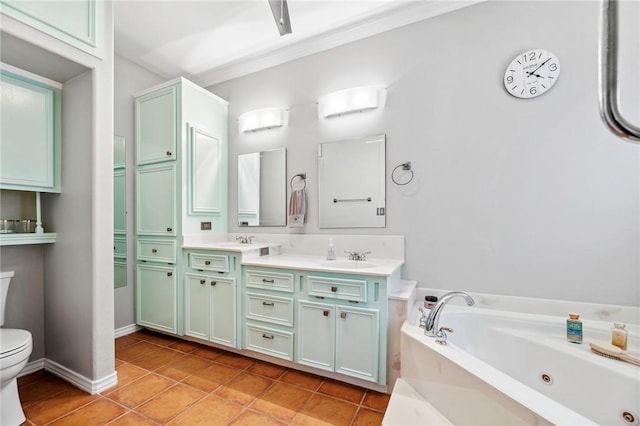 full bathroom featuring tile patterned flooring, toilet, a sink, a whirlpool tub, and double vanity