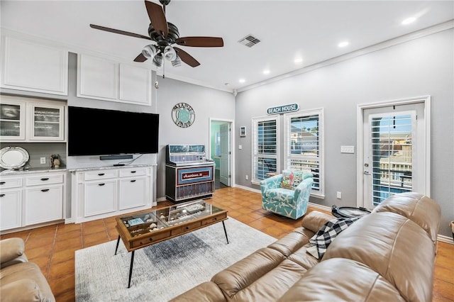 living room with recessed lighting, visible vents, ornamental molding, a ceiling fan, and baseboards