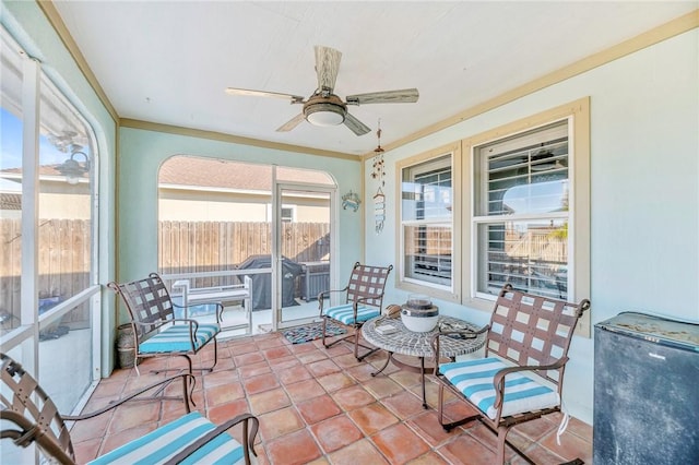 sunroom with a ceiling fan