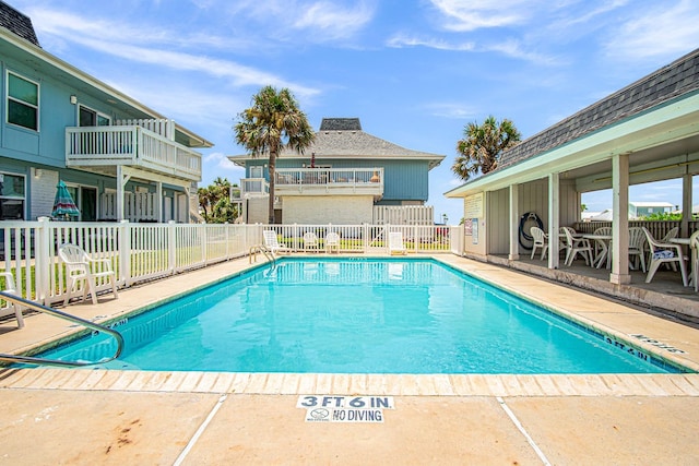 view of swimming pool featuring a patio